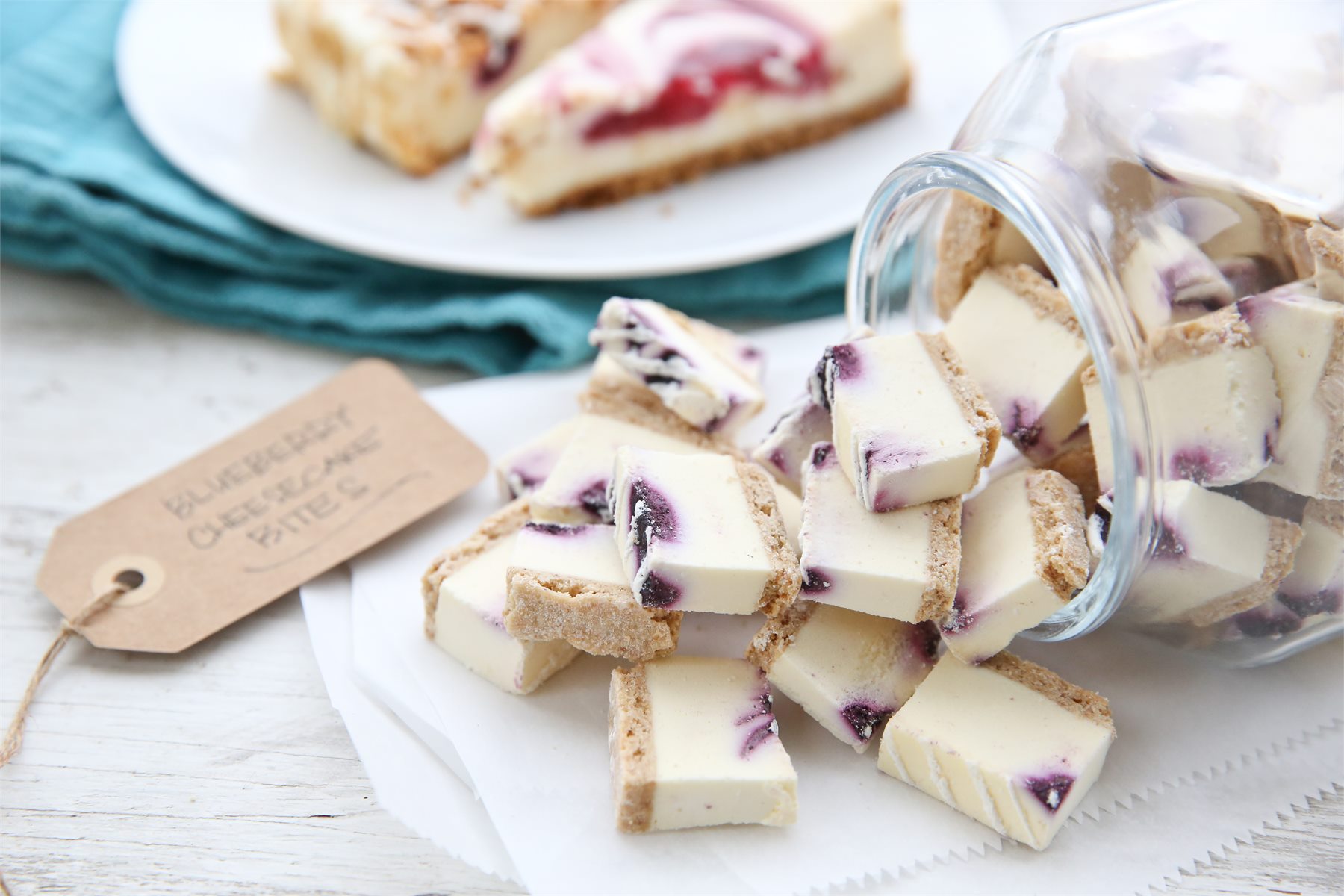 Berry cheesecake pieces portioned as small dessert bites