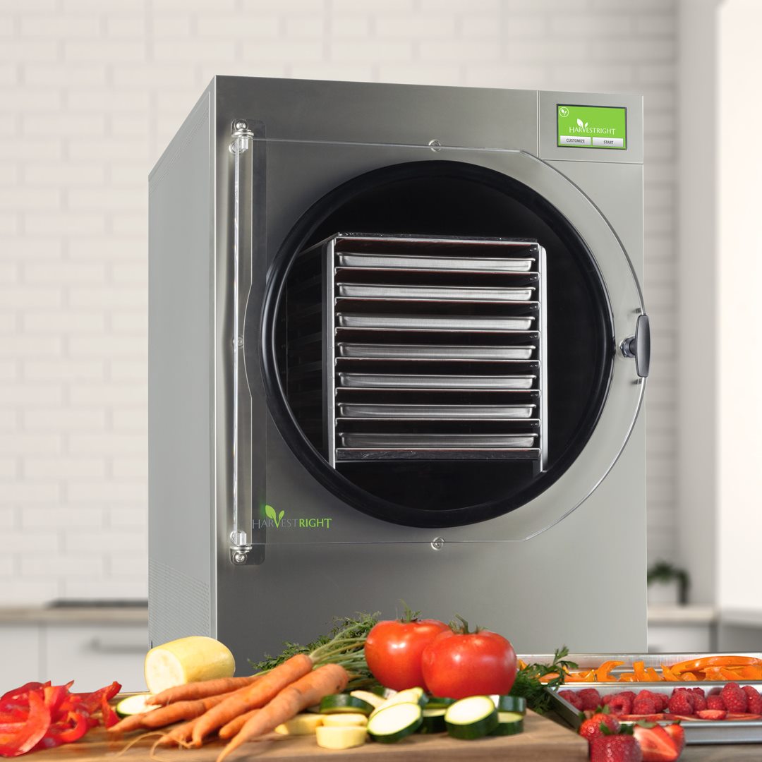 Stainless steel XL Home Pro freeze dryer beside fresh produce