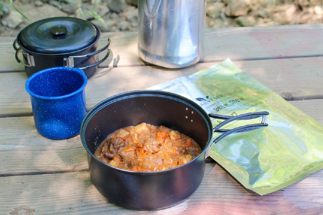 A hiker carrying lightweight food on a trail